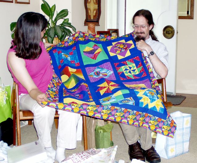 Cathy and Chris with quilt top