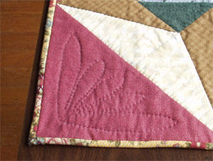 Detail of the quilting in the setting triangles